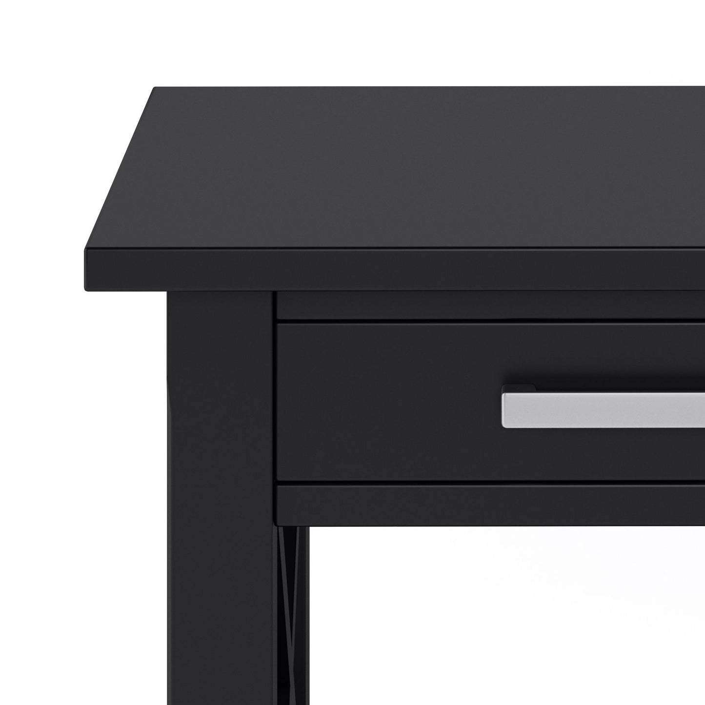 Close-up of the Kitchener - Handcrafted Table in black, showing its left side and front. Features a drawer with a rectangular metallic handle, all set against a white background.