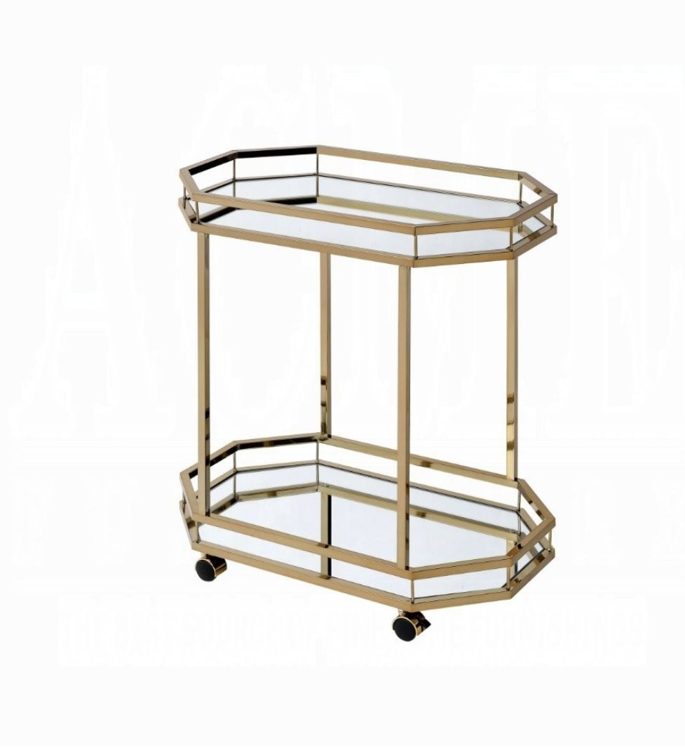 The Lacole Mirror Serving Cart in champagne features a geometric metal frame, two glass shelves, and four black caster wheels, displayed against a white background.