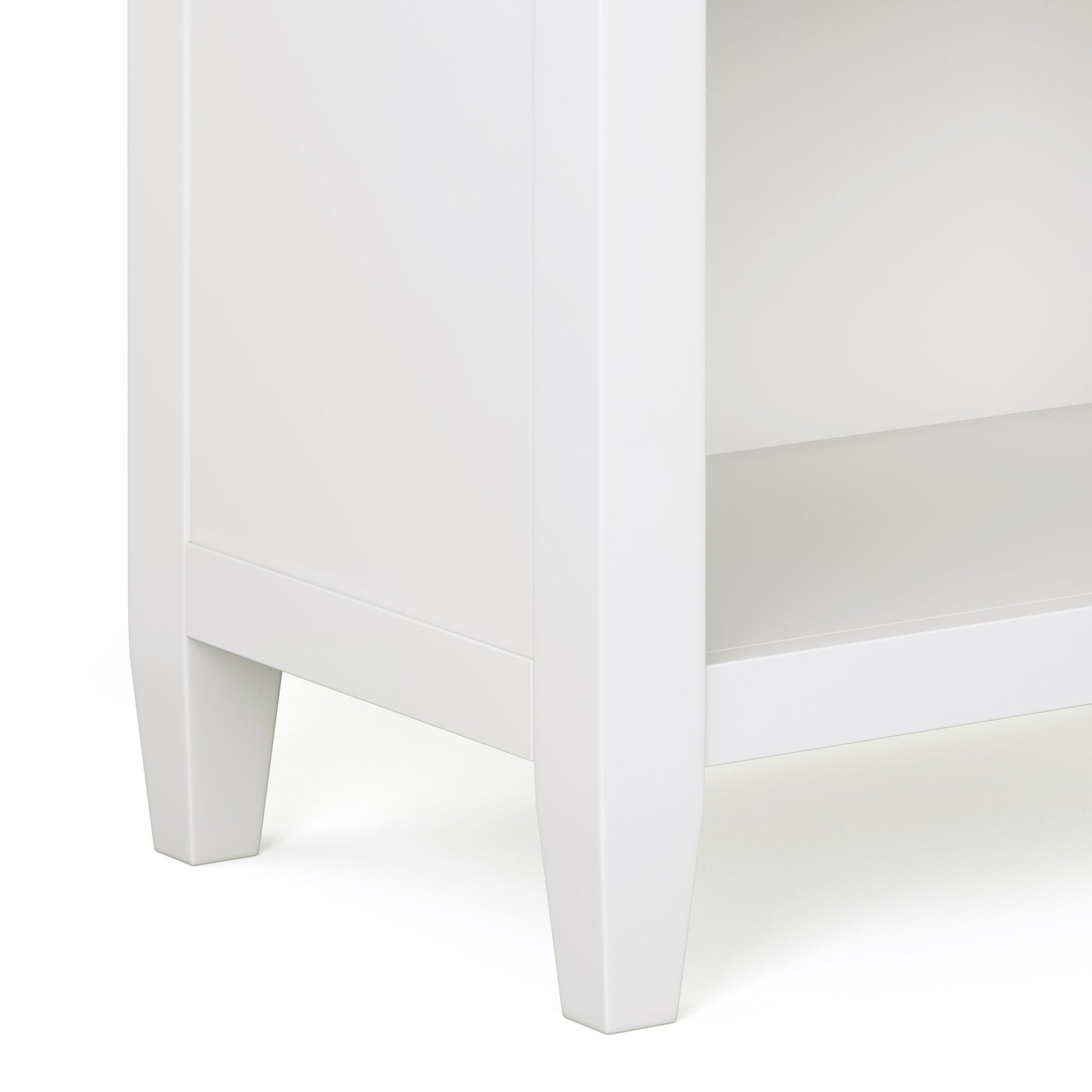 Close-up of the Carlton - Bedside Table, Handcrafted, featuring a white finish, clean lines, square legs, and a lower shelf.