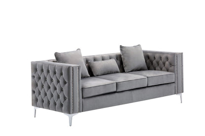 The Lorreto - Velvet Fabric Living Room Set features a modern gray velvet sofa with tufted back and sides, three seat cushions, two square pillows, one rectangular pillow, and metal legs—all shown against a white background.