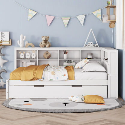 A cozy children's bedroom features the Wooden Full Size Daybed With Twin Size Trundle in white, with storage shelves and USB charging ports. Yellow and white bedding, colorful bunting on a blue wall, a round rug, and pillows complete the look.