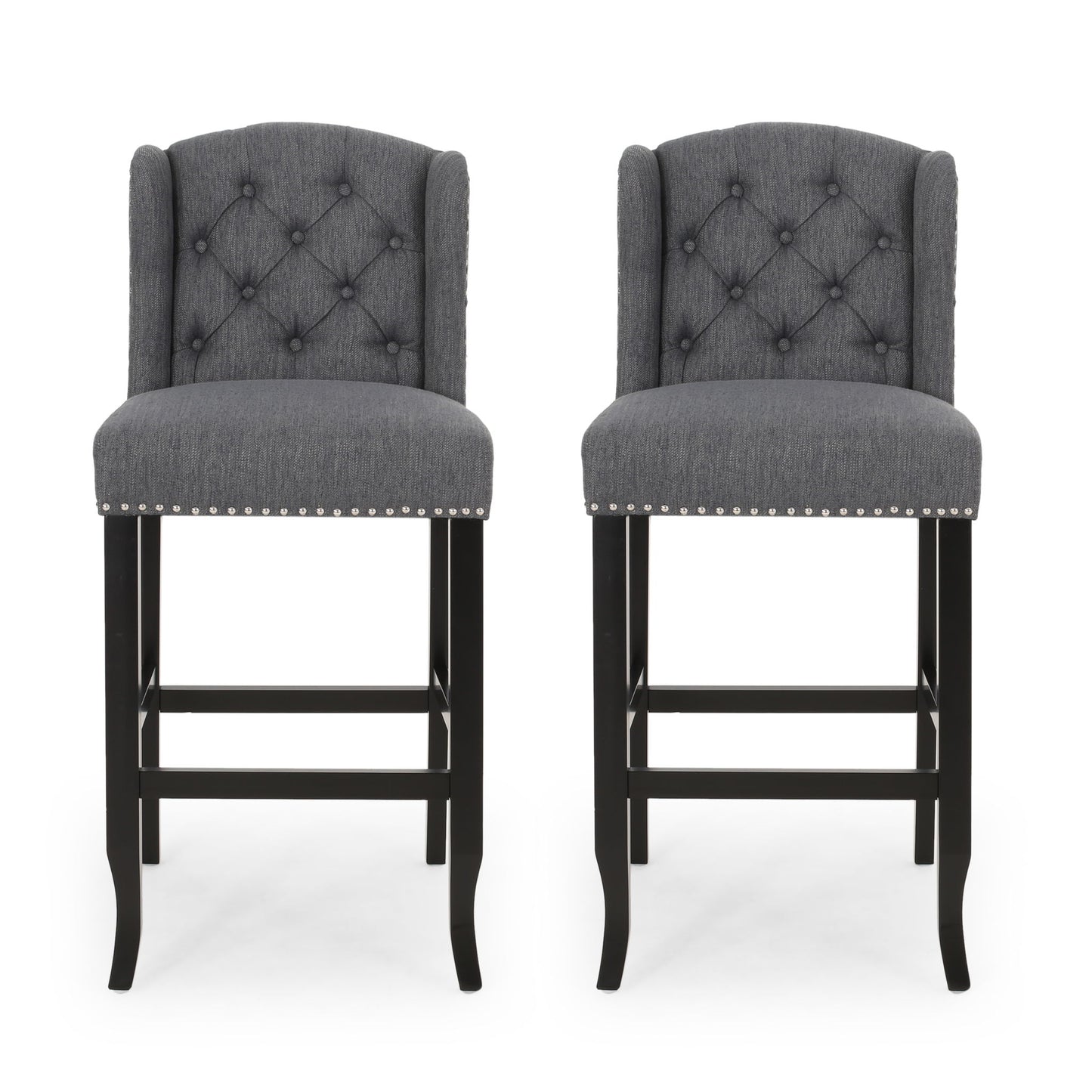 The Vienna - Contemporary Fabric Tufted Wingback Counter Stools (Set of 2) feature dark wooden legs, diamond-tufted gray fabric backs, and silver nailhead trim, shown side by side against a white background.