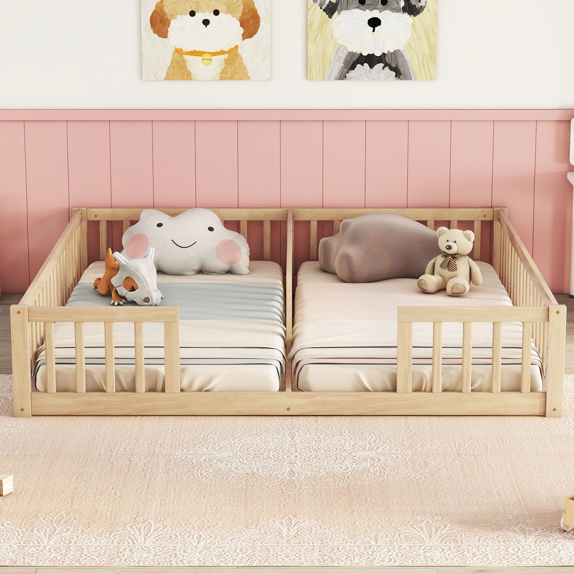 A Double Floor Bed With Fence and Guardrails (no door) holds two mattresses with soft toys like a teddy bear, plush cloud, and animal. The room features a pink wall and dog-themed artwork above the bed.