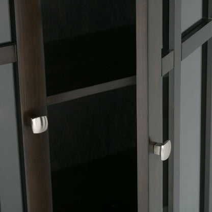 Close-up of the Bedford - Storage Media Cabinet, featuring dark wood, glass doors, silver square handles, and an empty interior shelf.