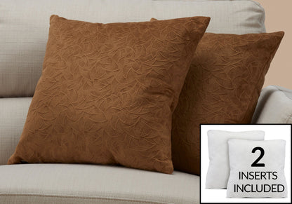 Two Pillow Square decorative throw pillows with a brown textured cover sit on a light beige sofa. Inset displays two white hypoallergenic pillow inserts and text: "2 INSERTS INCLUDED.