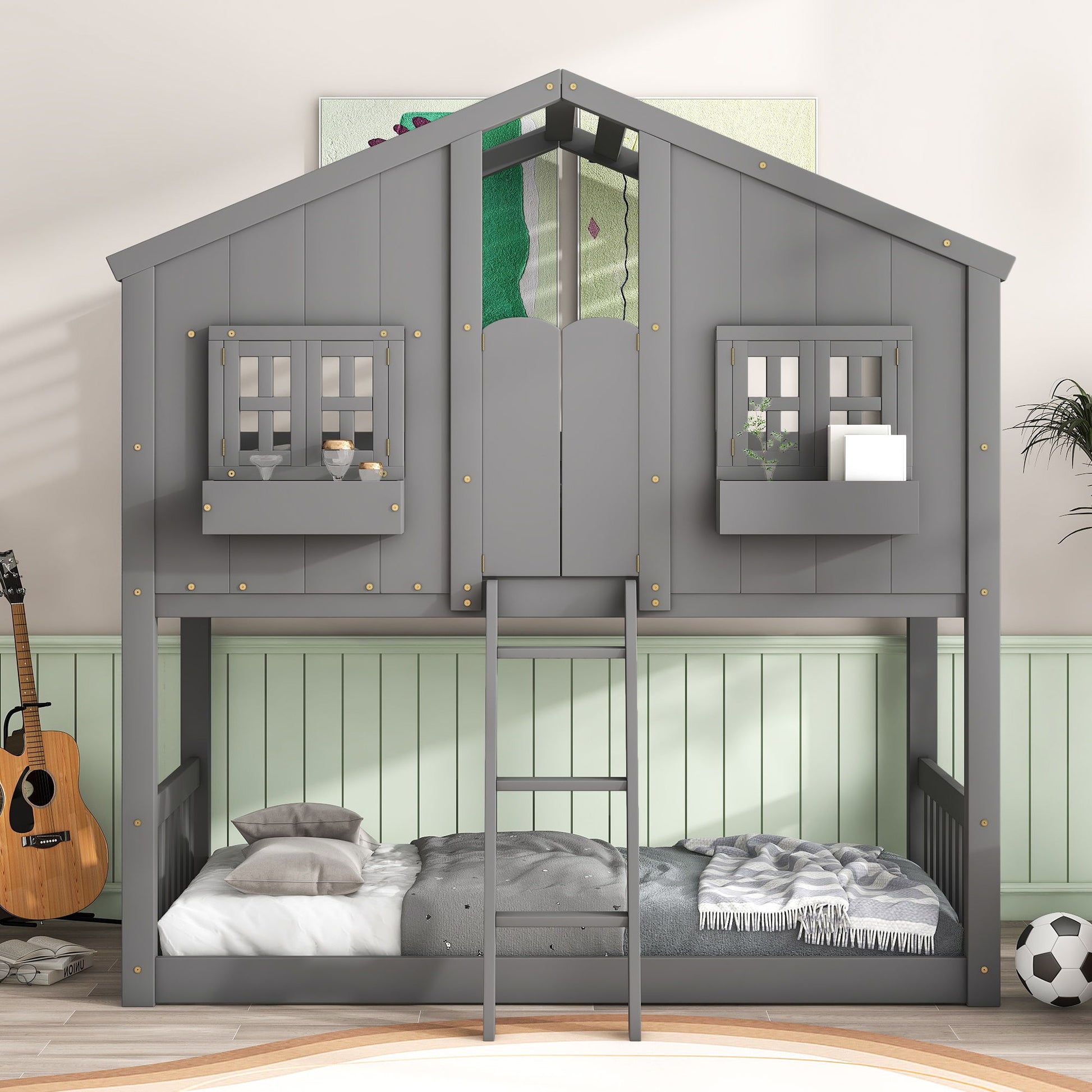 A gray House Bunk Bed with roof, window, window box, door, safety guardrails and ladder stands against a paneled green wall. The bunk bed features cozy lower and upper beds and is styled with a guitar on the side.