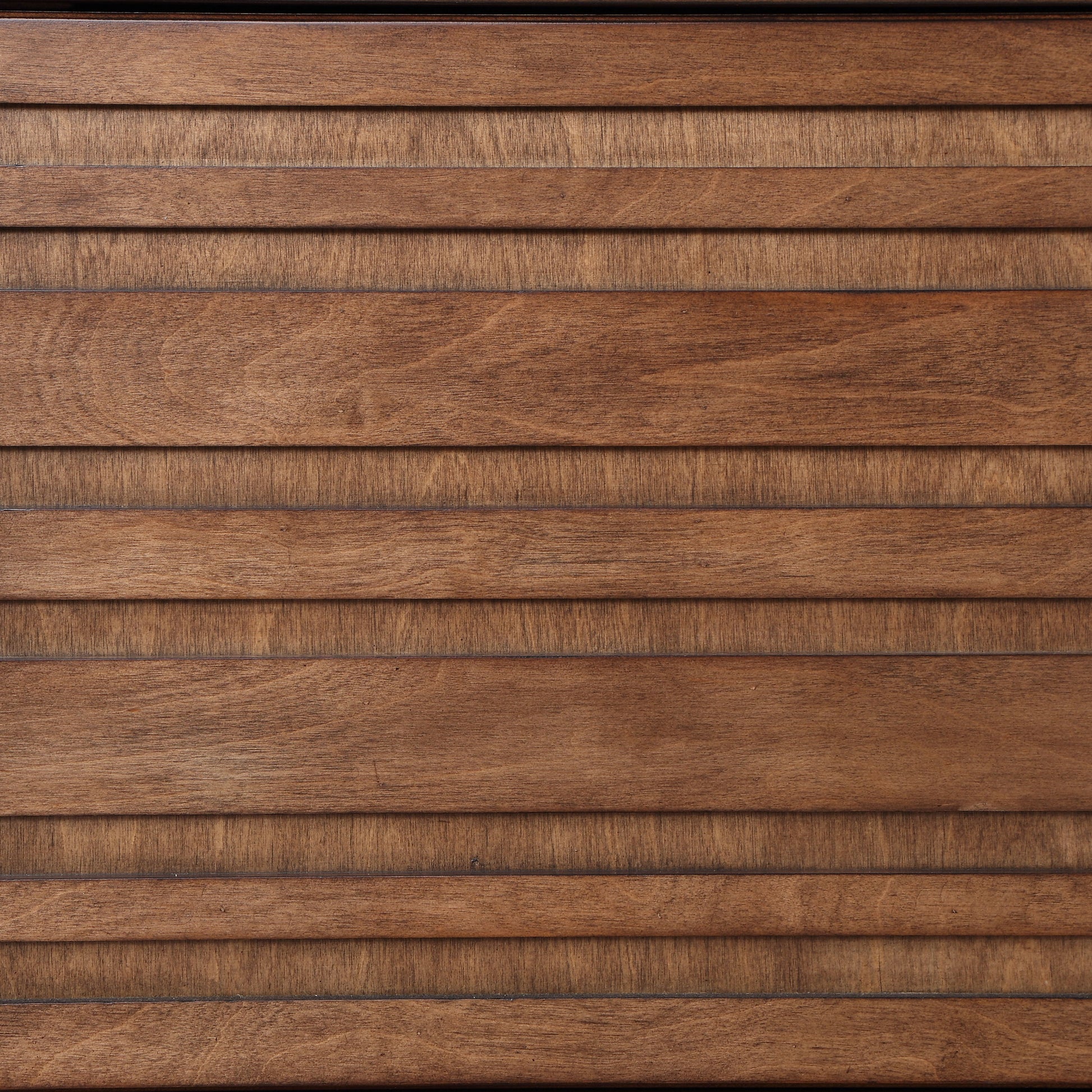 Close-up of the Sausalito TV Stand Console, showcasing its wooden surface with horizontal slats, smooth finish, and natural wood grain patterns in warm brown tones.