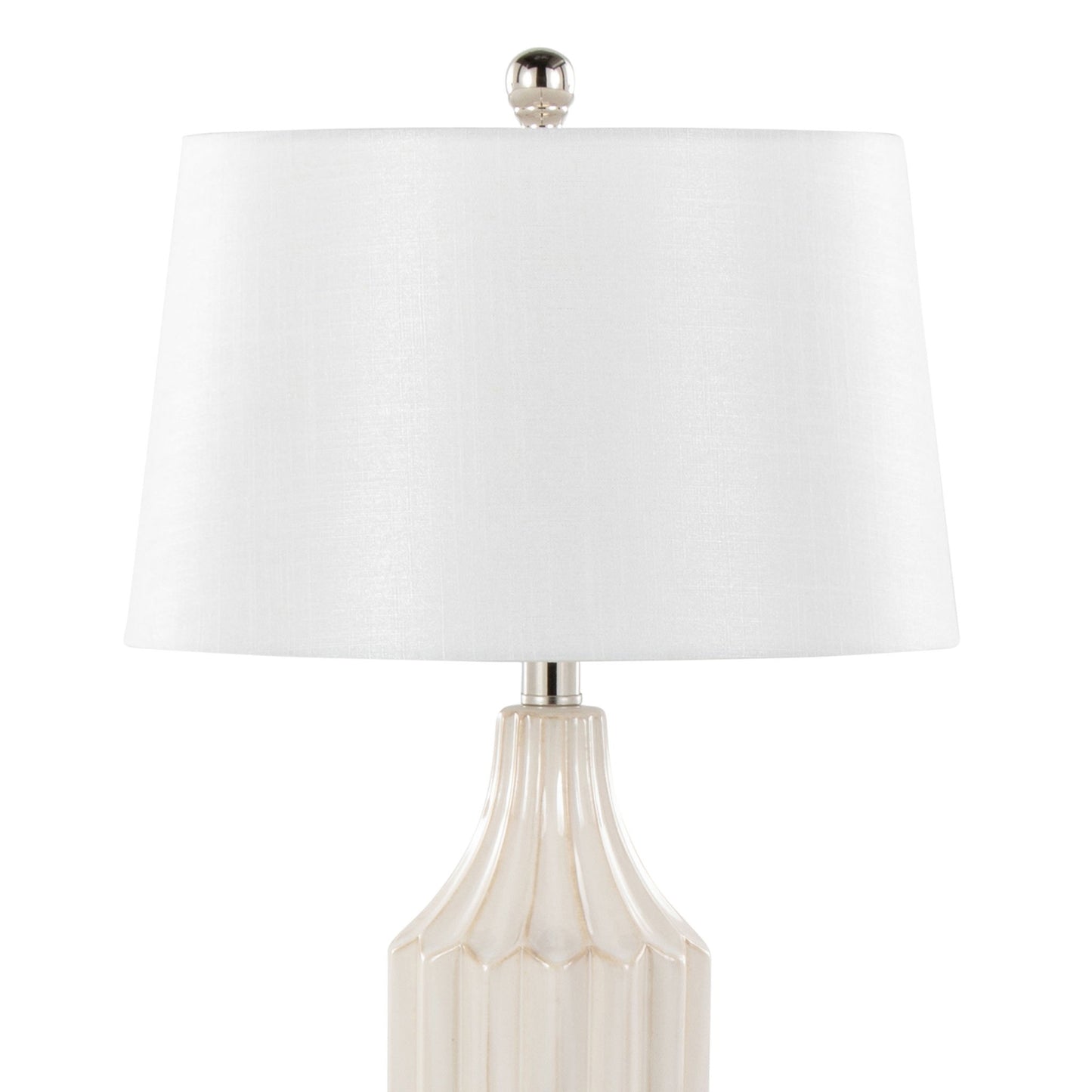 The Stella Contemporary Table Lamp features a beige ceramic base with vertical ridges, a white drum-shaped lampshade, and a silver finial for a stylish modern look.