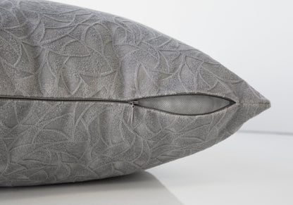 A close-up of the Pillow Square Decorative Throw shows its subtle gray leaf pattern and partially open side zipper against a plain white background; insert is included and it's hypoallergenic.