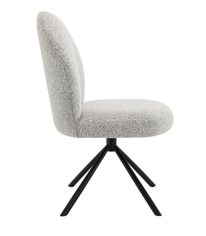 Side view of the Lawton - Boucle Side Chair With Swivel (Set of 2) in gray, featuring a rounded cushioned back and seat upholstered in light gray boucle fabric, supported by four black angled metal legs.