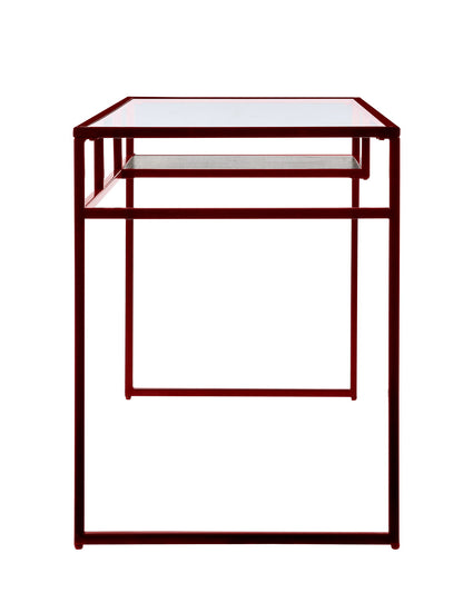 The Yasin - Glass Top Writing Desk features a minimalist, geometric design with a red metal frame and a clear glass top, shown from the front.