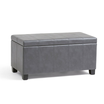 The Dover Upholstered Storage Ottoman Bench is a rectangular gray bench with short black legs, a tufted lid, and a simple modern design—perfect for stylish storage.
