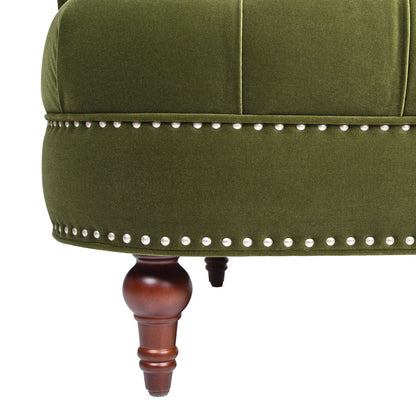 Close-up of the La Rosa - Victorian Chesterfield Loveseat featuring green upholstery, decorative silver studs along the edge, and a wooden turned leg.