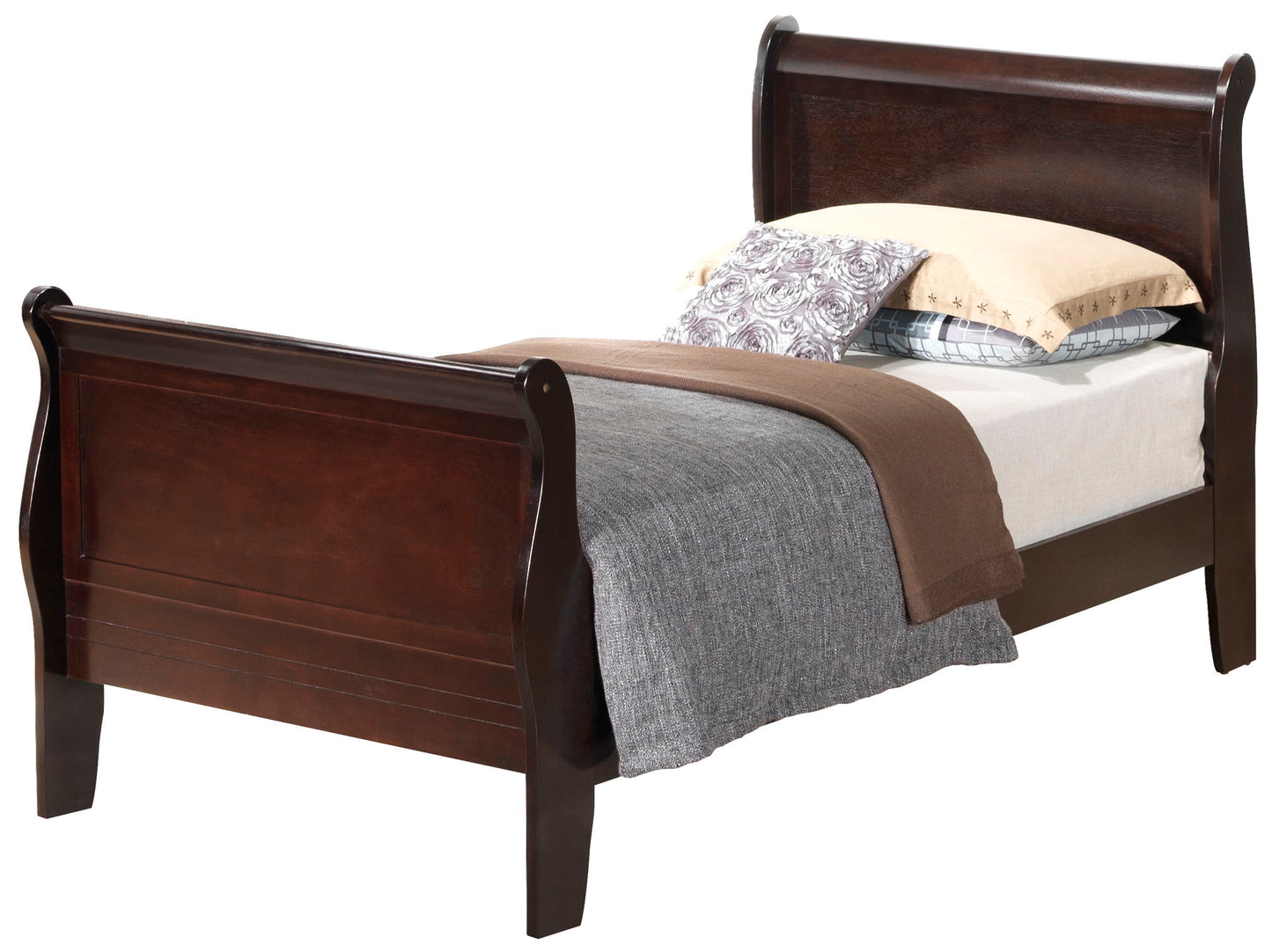 The Panel Sleigh Bed features a dark wood finish, styled with a gray blanket, brown throw, and multiple pillows arranged at the head.