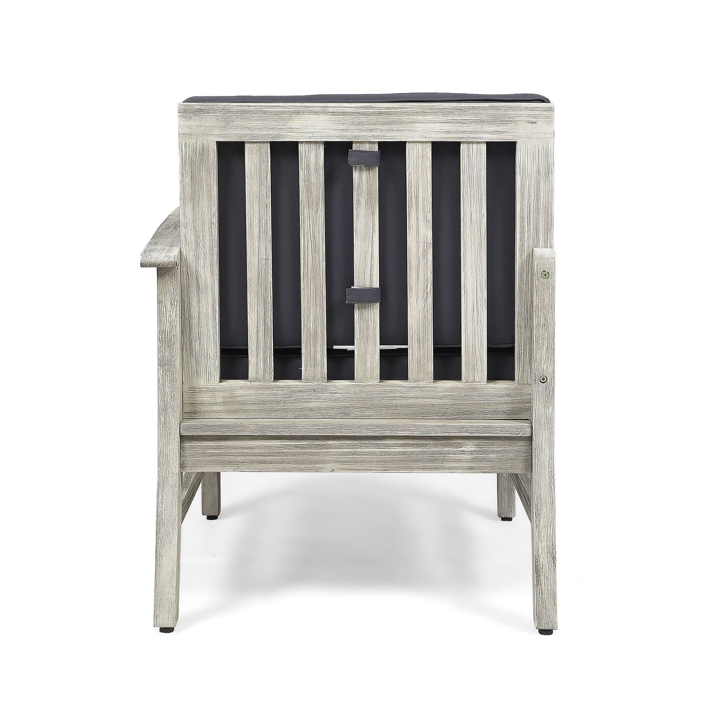 The Perla - Armchair is a wooden chair with a weathered gray finish, seen from the back, featuring vertical slats and a dark cushion attached to its backrest.