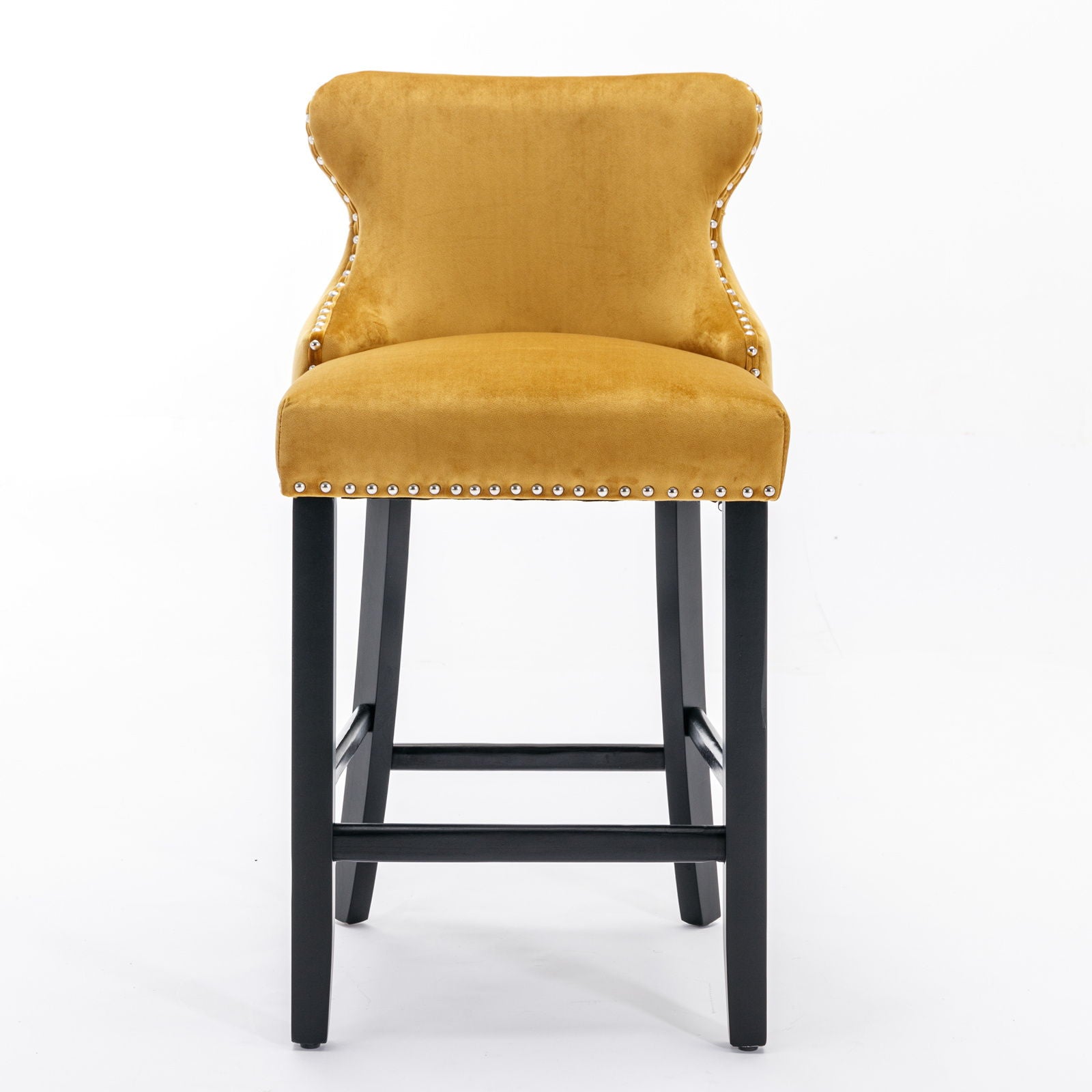 A set of 2 contemporary yellow velvet wing-back barstools with button tufted decor, chrome nailhead trim, curved backrest, and black wooden legs, set against a white background.