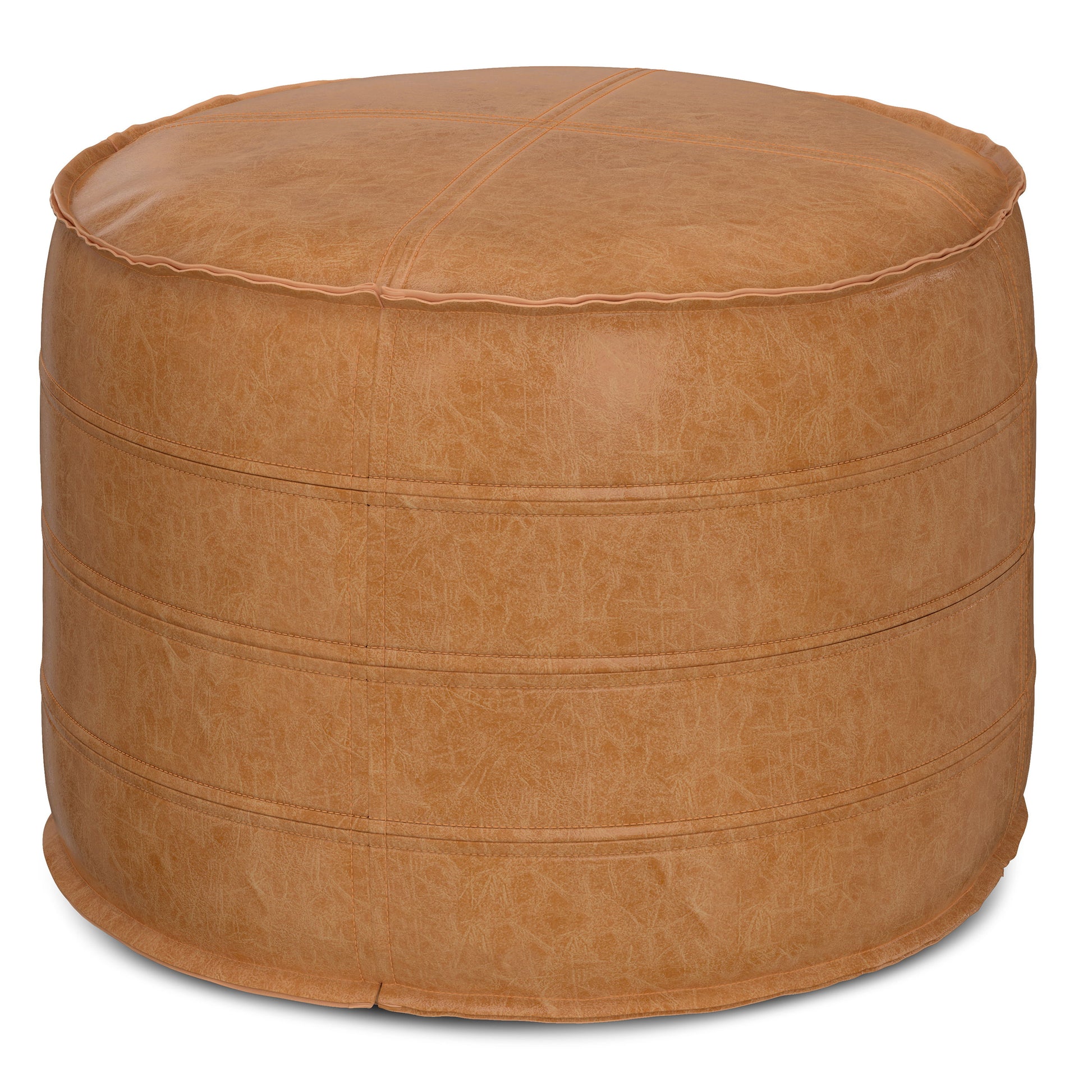 The Brody - Round Pouf is a tan leather ottoman featuring visible stitching and a slightly textured surface, shown against a white background.