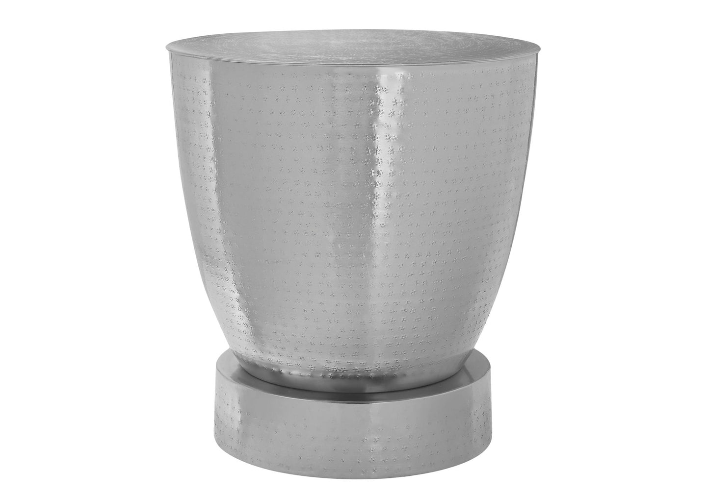 The Drum Accent Side Table features a shiny silver finish, rounded body, wide flat base, and a subtle hammered texture for contemporary and modern style.