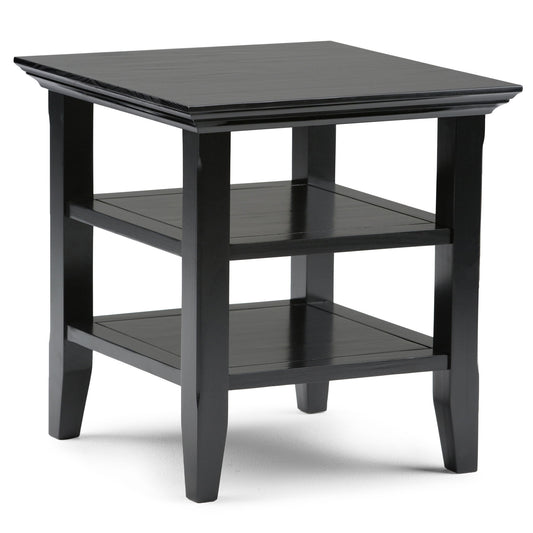 The Acadian - Handcrafted End Table is a black wooden piece with a square top, two lower shelves, and four straight legs, featuring a simple modern design.