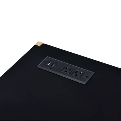 A close-up of the Midriaks Writing Desk With USB shows a built-in power outlet panel with two electrical sockets, two USB charging ports, and a gold-colored corner accent.