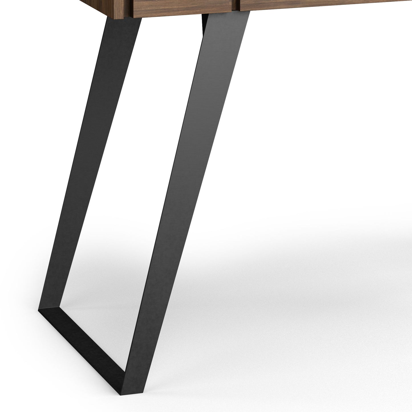 A close-up of the Lowry - Handcrafted Desk shows its angled black metal leg supporting a wooden tabletop against a white background.