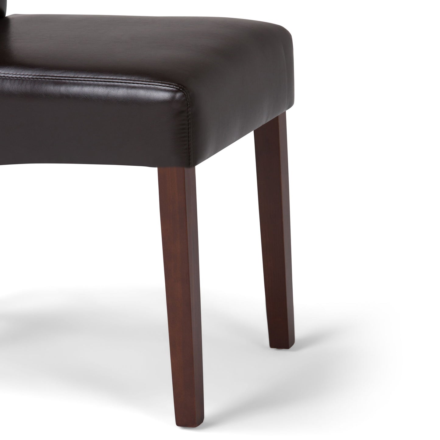 Close-up of the Avalon - Deluxe Parson Dining Chair (Set of 2) featuring a dark brown leather seat and wooden legs, shown on a plain white background. Only part of the seat and two legs are visible.