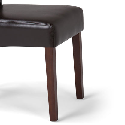 Close-up of the Avalon - Deluxe Parson Dining Chair (Set of 2) featuring a dark brown leather seat and wooden legs, shown on a plain white background. Only part of the seat and two legs are visible.