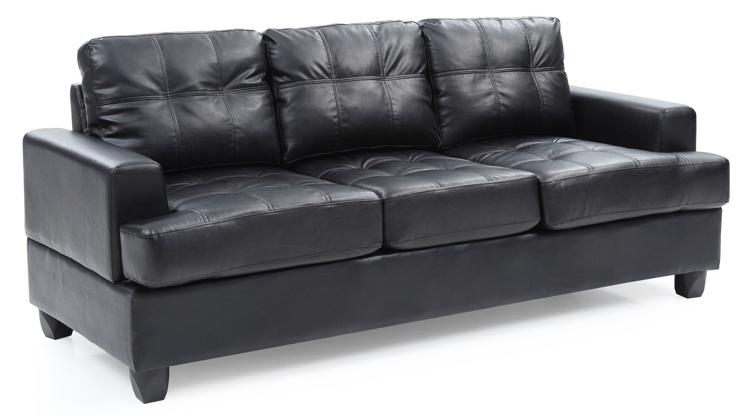 The Sandridge Sofa is a black leather piece with three seat and back cushions, visible tufted stitching, straight armrests, and short legs.