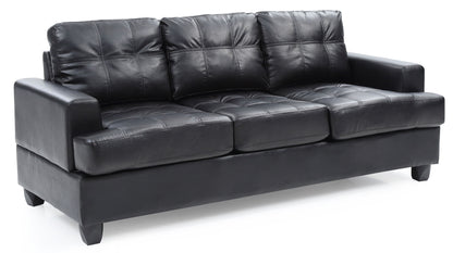 The Sandridge Sofa is a black leather piece with three seat and back cushions, visible tufted stitching, straight armrests, and short legs.