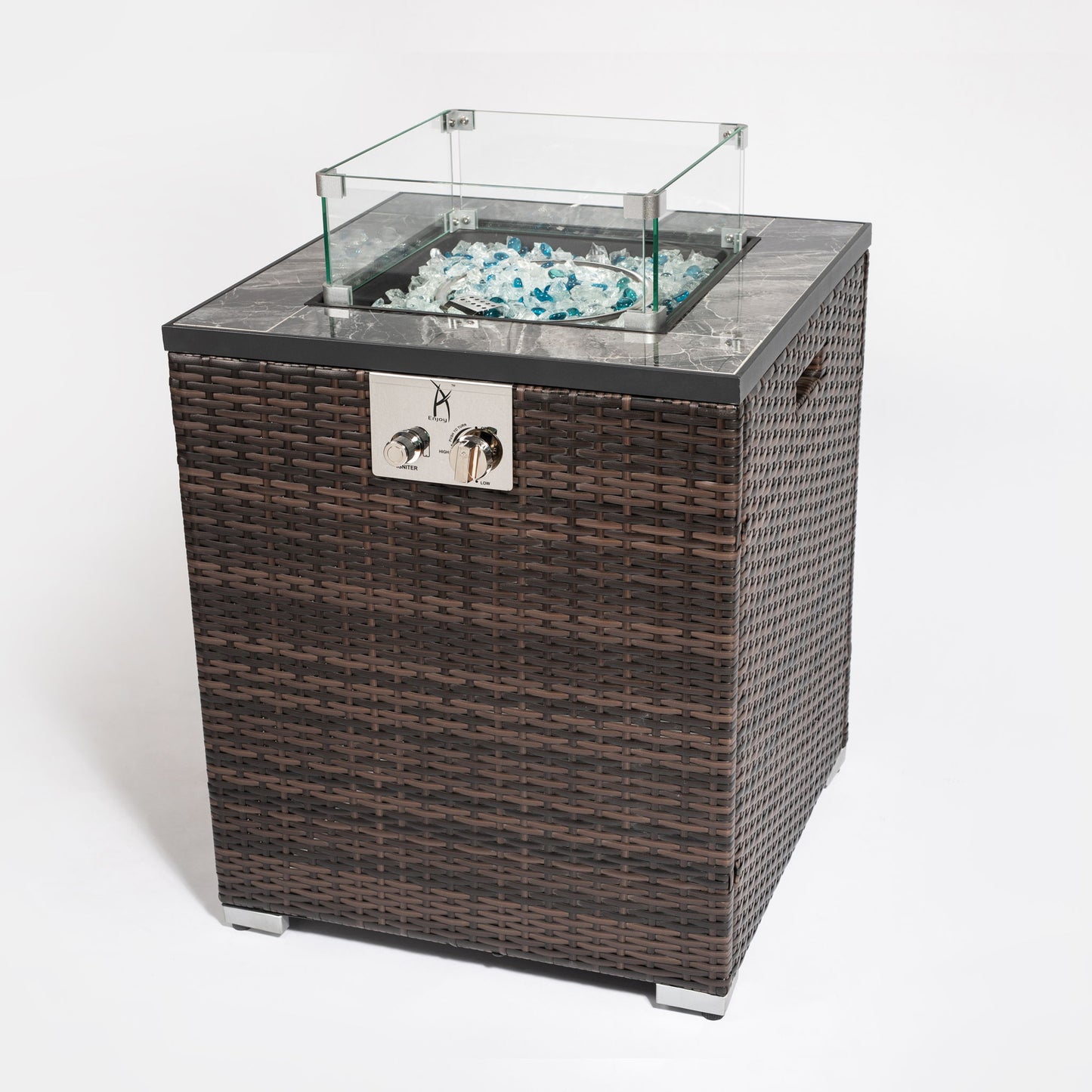 The Propane Gas Square Fire Pit features a tile tabletop, elegant wicker-style base, glass wind guard, clear fire glass, and front metal control knobs. Shown on a white background.