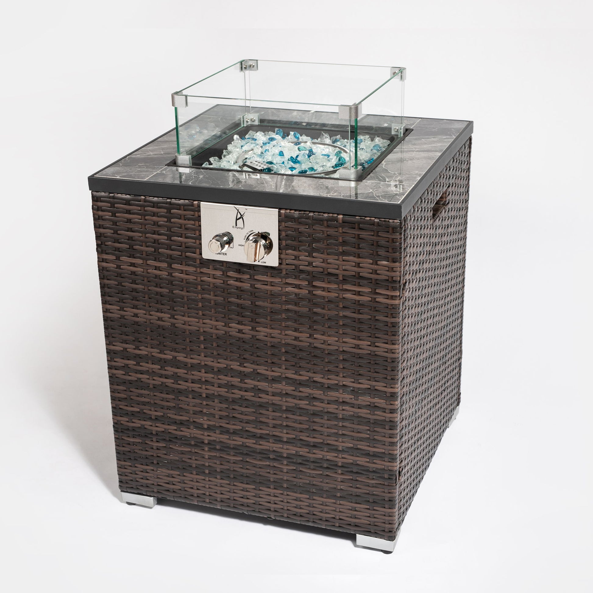 The Propane Gas Square Fire Pit features a tile tabletop, elegant wicker-style base, glass wind guard, clear fire glass, and front metal control knobs. Shown on a white background.
