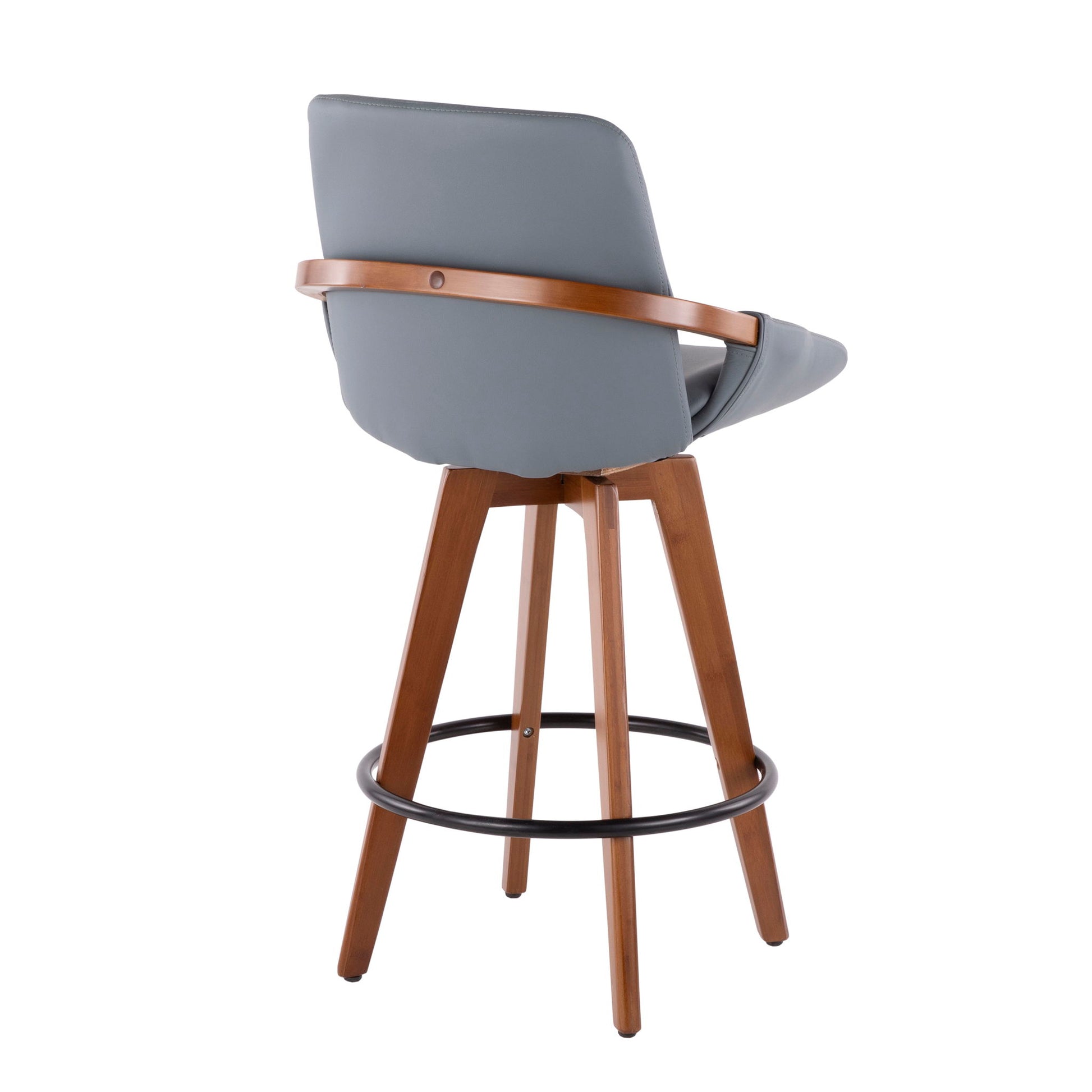 The Cosmo - Mid Century Counter Stool features a light blue cushioned seat and backrest, wood legs, a circular black metal footrest, and a wooden accent around the backrest. Shown at an angle highlighting its back and side.