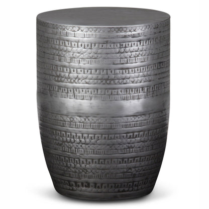 The Johnsen - Handcrafted Large Metal Accent Table is a cylindrical piece with a shiny silver finish, featuring intricate horizontal etched patterns and a smooth, flat top—perfect as a stool or side table.