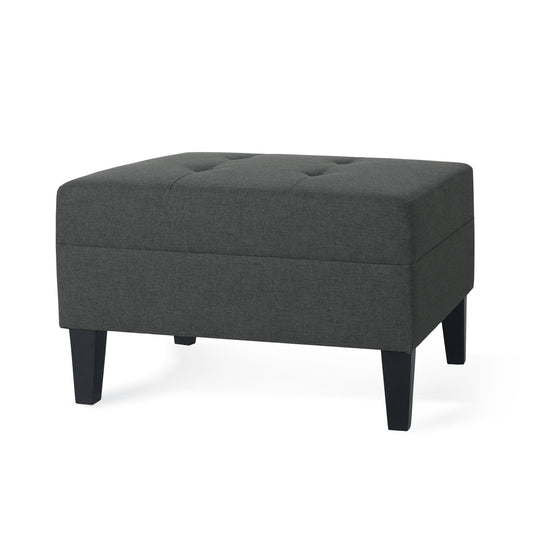 The Classic Ottoman features fabric upholstery in dark gray, a tufted top, and four black birch wood legs, shown against a white background.