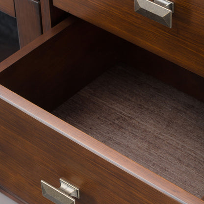 A close-up of an open, empty drawer with a metal handle in the Artisan - Handcrafted Sideboard Buffet, showing its polished dark brown finish and part of another closed drawer above.