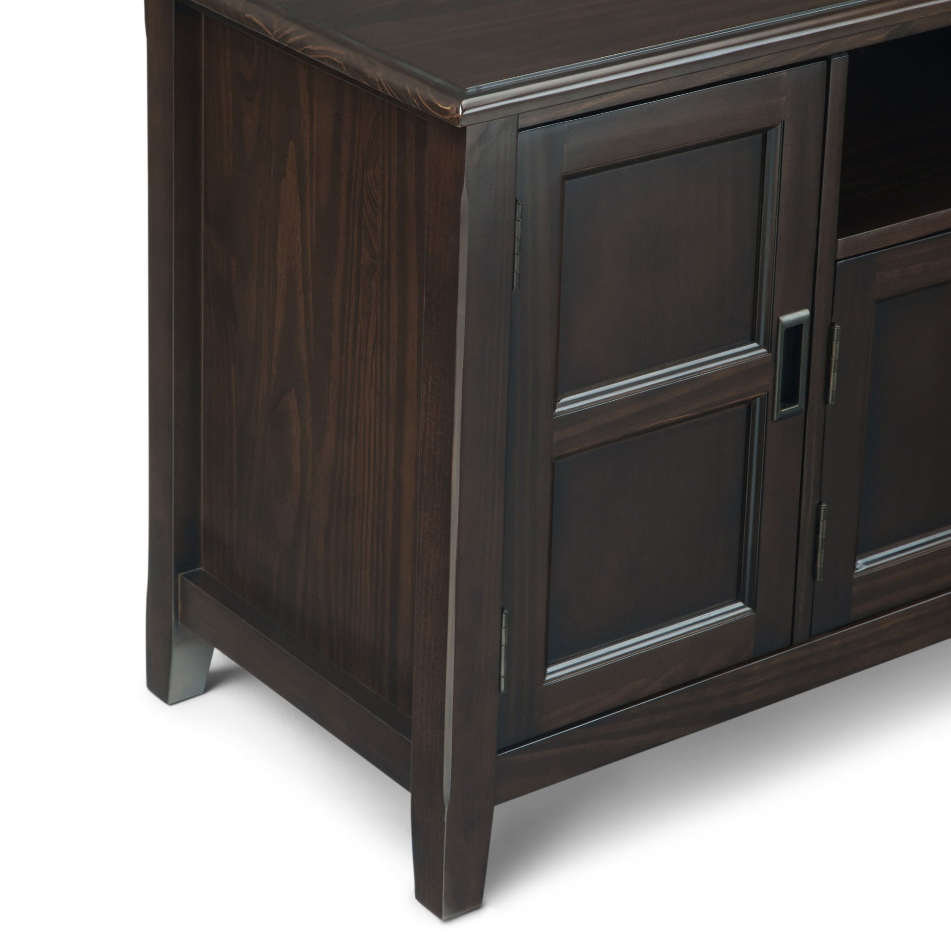 Close-up of the Burlington - TV Media Stand's dark wood corner, featuring paneled doors, metal handles, and sturdy square legs on a white background.