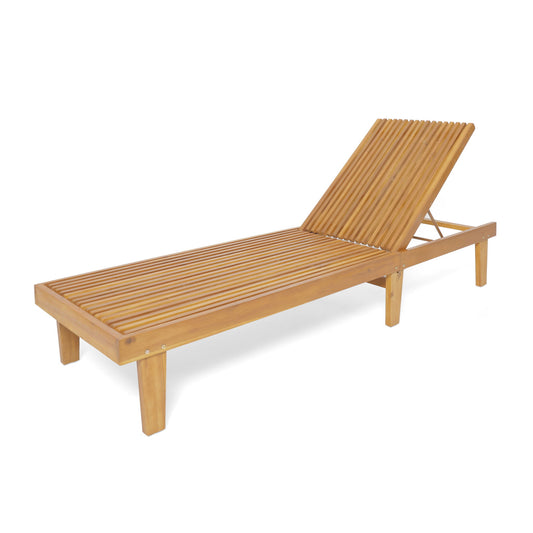 The Nadine - Stylish Chaise Lounge Chair - Teak features a slatted wooden design, adjustable backrest, natural teak finish, and four sturdy legs. Shown angled for an inviting outdoor look.