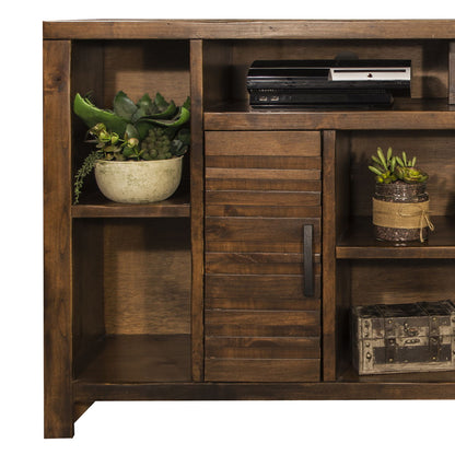 The Sausalito TV Stand Console for TVs features a wooden shelving unit with a sliding slatted door and space for decor like succulents, electronics, burlap-wrapped plants, and a decorative metal box.