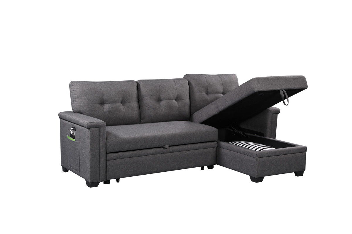 The Nathan Reversible Sleeper Sectional Sofa in gray features tufted back cushions, a storage chaise with a striped blanket, USB charging ports, and a side pocket on the armrest.