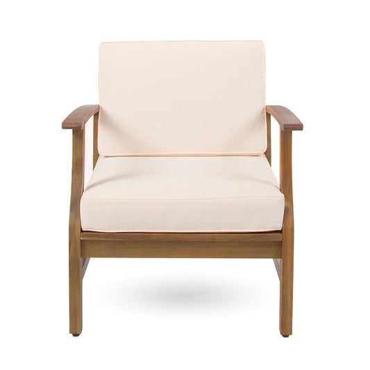 The Perla - Contemporary Club Chair features a sturdy rectangular wooden frame, curved armrests, and water-resistant light beige cushions in a simple, modern design. Shown here from the front.