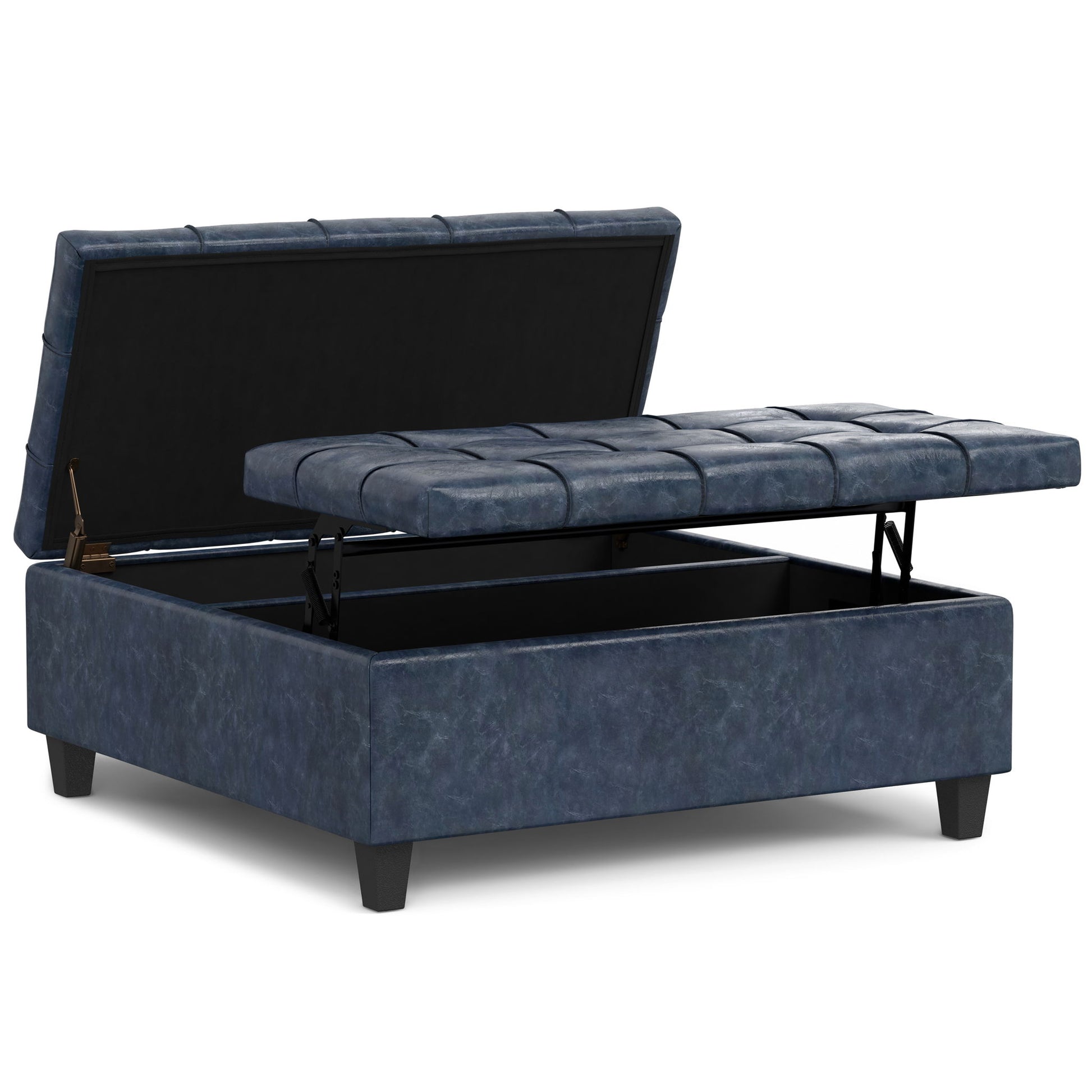 The Harrison Upholstered Coffee Table Storage Ottoman features dark blue upholstery, a cushioned tufted lift-top that reveals hidden storage, and stands on four short black legs.