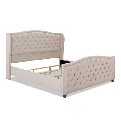 The Marcella Upholstered Shelter Headboard Bed Set features a beige tufted, curved headboard and footboard, wooden legs, and decorative nailhead trim. Frame is shown without mattress or bedding.