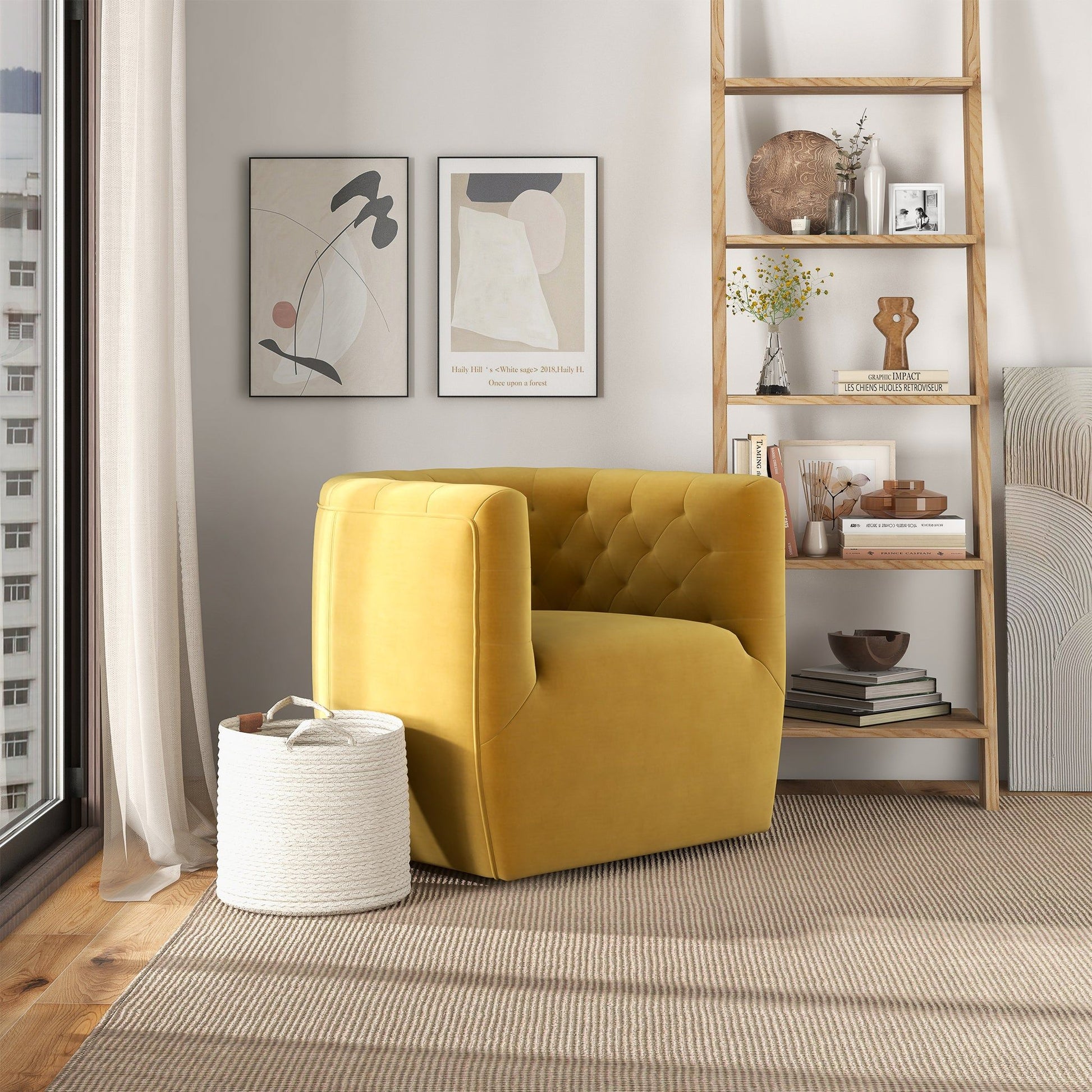 A modern living room corner with the Delaney - Ergonomic Design Swivel Chair in mustard yellow, a white woven basket, a wooden shelving unit with décor, and two abstract art prints. Natural light streams in from a large window.