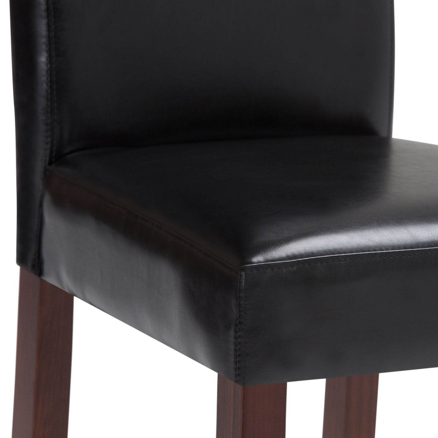 A close-up of the Acadian - Upholstered Parson Dining Chair (Set of 2), showcasing its black leather seat and backrest with dark wooden legs.
