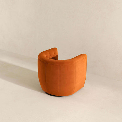 The Delaney - Ergonomic Design Swivel Chair, featuring orange tufted upholstery and a modern barrel shape, is placed on a light beige floor against a matching light beige wall.