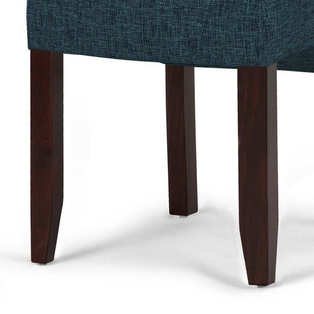 Close-up of the Cosmopolitan - Deluxe Tufted Parson Upholstered Chair (Set of 2), featuring dark wooden legs and teal textured upholstery, against a white background.