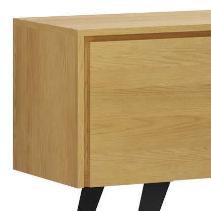 A close-up of the Lowry - Handcrafted TV Media Stand, featuring a modern light oak finish, simple clean lines, and distinctive black angled legs.