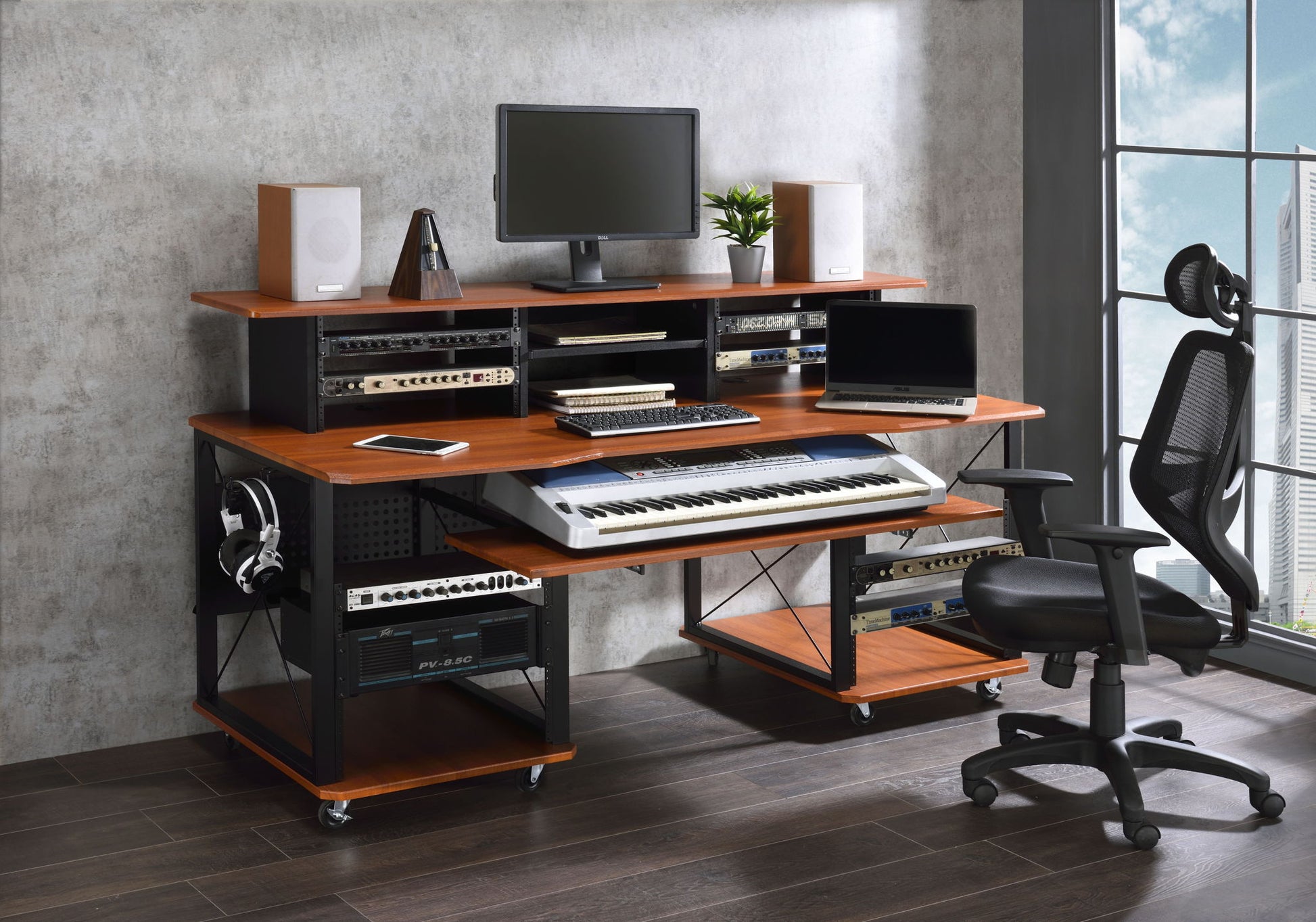 A modern home music studio featuring the Megara - Music Desk with multiple storage, a computer monitor, keyboard, speakers, audio equipment, digital piano, headphones, office chair, and a large window.