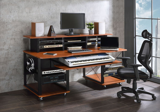 A modern home music studio featuring the Megara - Music Desk with multiple storage, a computer monitor, keyboard, speakers, audio equipment, digital piano, headphones, office chair, and a large window.