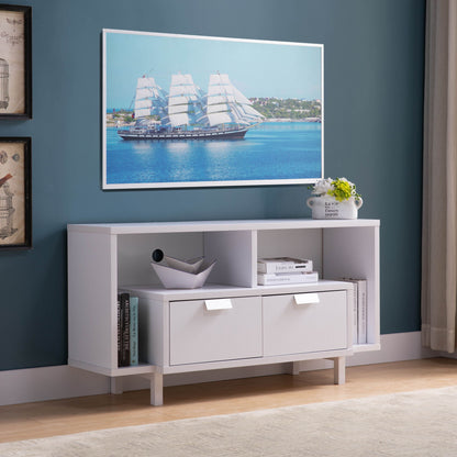 A Modern TV Stand with two shelves and two drawers stands against a blue wall, decorated with books, accessories, and a flower vase. Above it hangs a framed photo of a sailing ship on blue water.